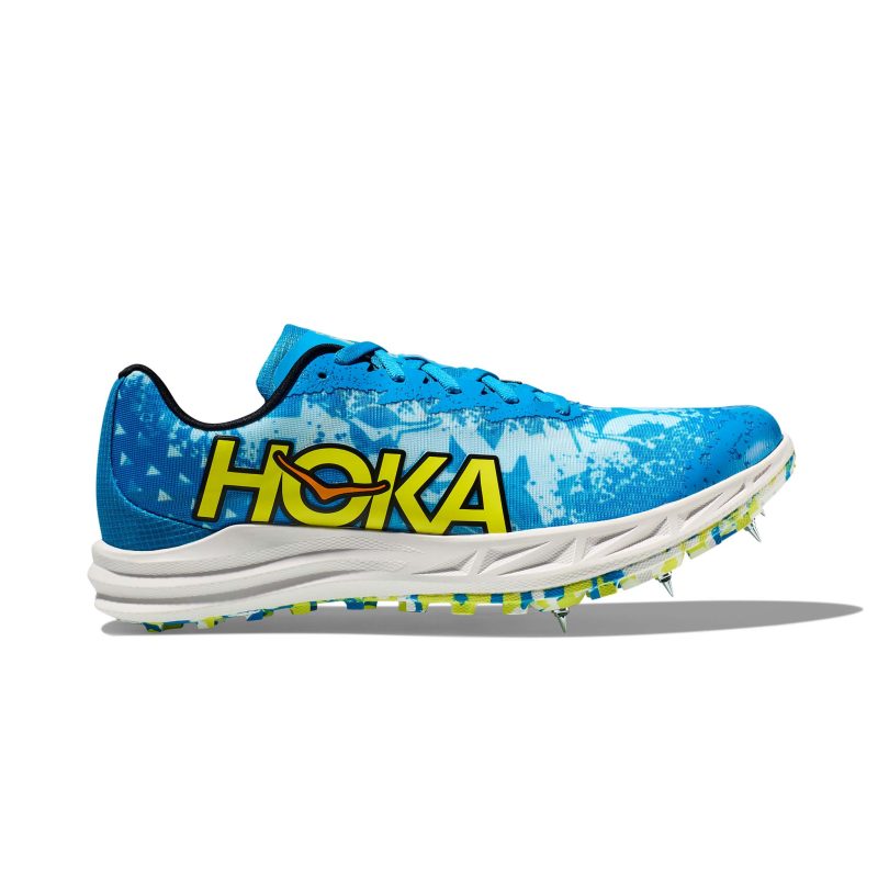 Lateral side of the right shoe from a pair of Hoka Unisex Crescendo XC Spikes in the Diva Blue/Evening Primrose colourway (7922066096290)