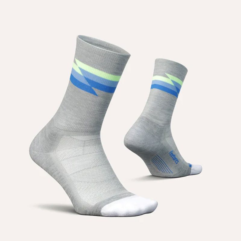 A pair of Feetures Unisex Elite Light Cushion Mini Crew running socks in the Synthwave gray colourway (8149400223906)