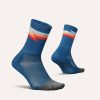 A pair of Feetures Unisex Elite Light Cushion Mini Crew running socks in the Synthwave Blue colourway (8149397078178)