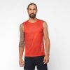 Front view of a model wearing a Salomon Men's Sense Aero Tank in the Fiery Red colourway (7891195986082)