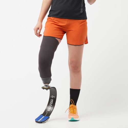 Front view of a model wearing a pair of Salomon Women's Sense Aero 5" Shorts in the Burnt Ochre colourway (8000773193890)